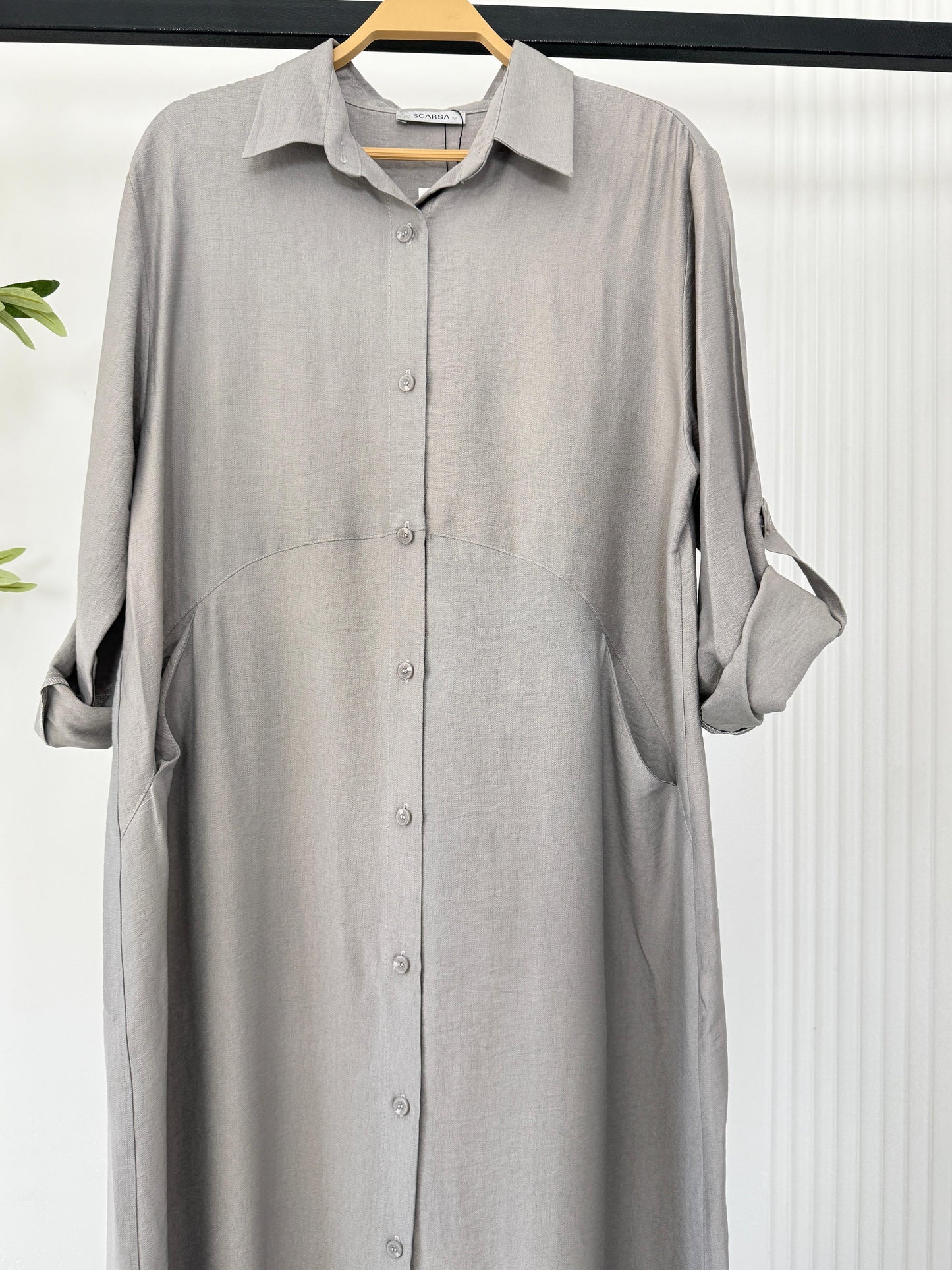 Light blue Amenaa shirt dress with a relaxed fit, featuring a collar, button-front, and knee-length hem.