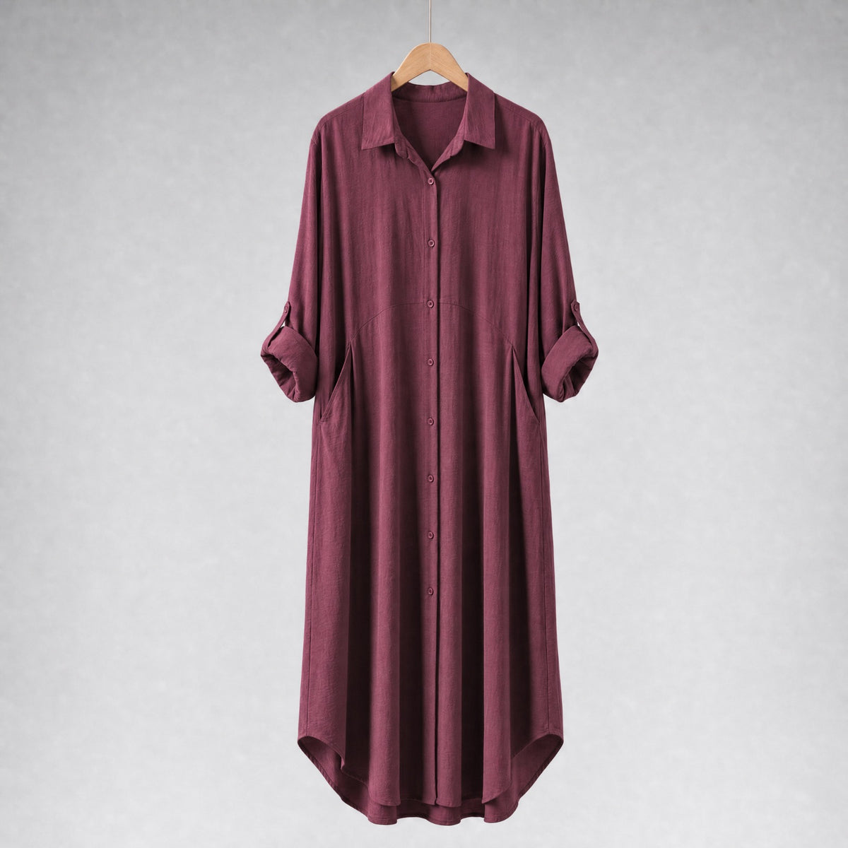 Amenaa shirt dress with a relaxed fit, featuring a collar, long sleeves, and a waist tie for casual elegance.