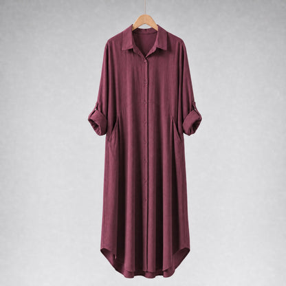 Amenaa shirt dress with a relaxed fit, featuring a collar, long sleeves, and a waist tie for casual elegance.