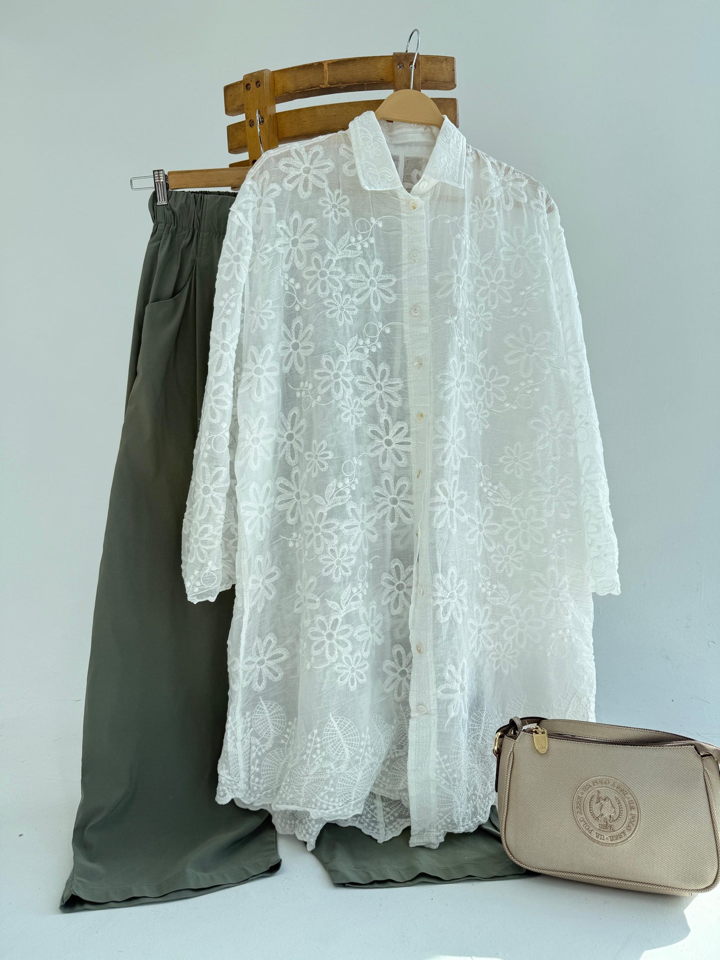 Amenaa Guipure Shirt with intricate lace detailing, long sleeves, and a classic collar, displayed on a hanger.