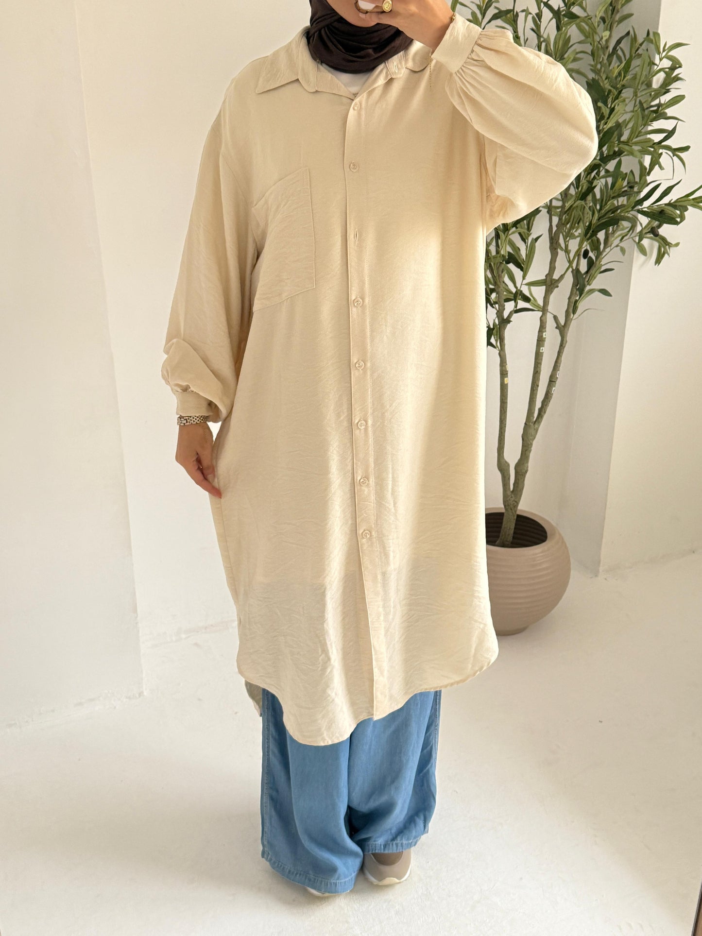 Long beige chemise by Amenaa with soft fabric, flowing fit, and delicate straps, perfect for comfortable and elegant loungewear.