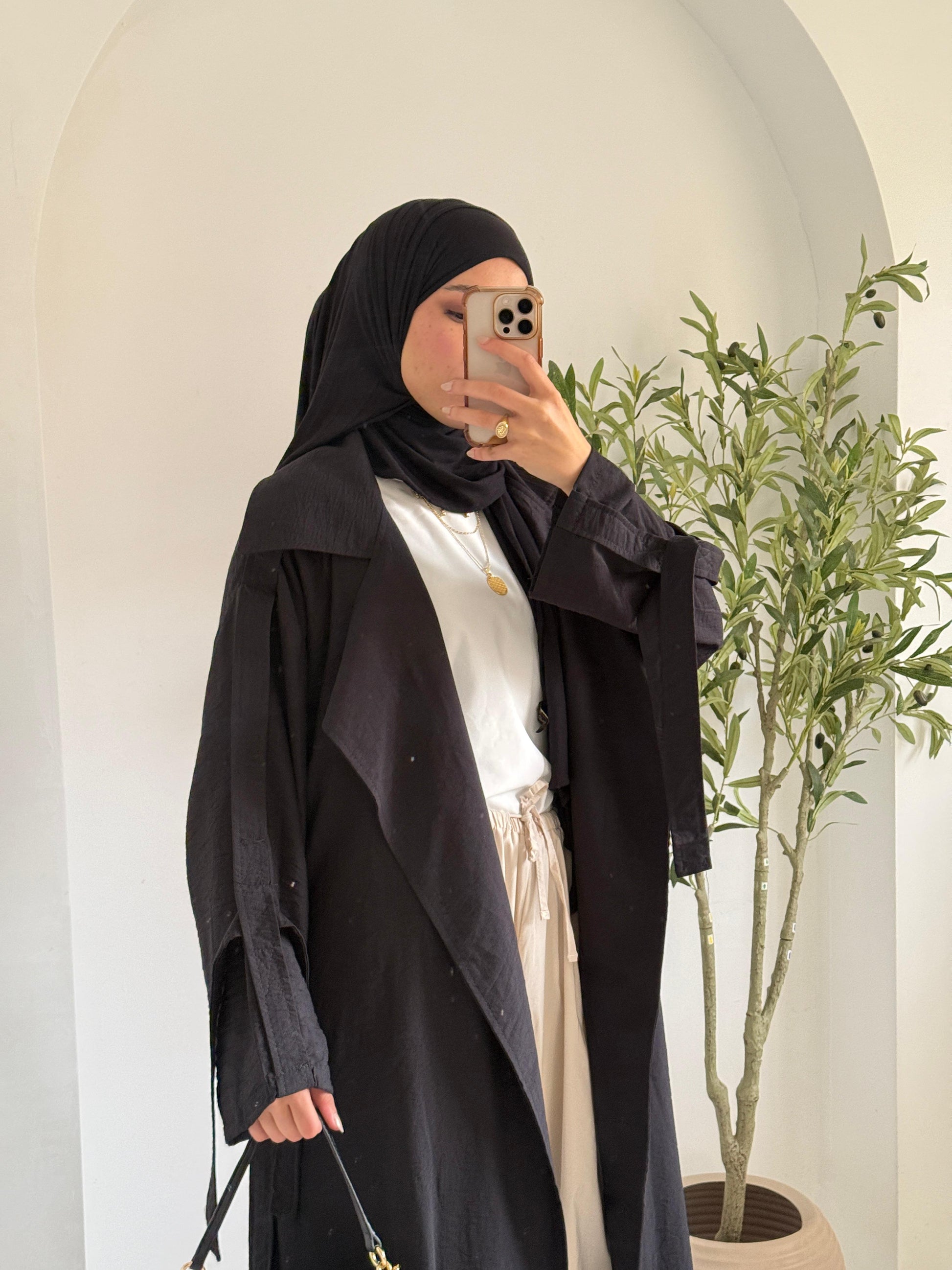 Amenaa summer trench coat in light fabric, beige color, stylish design with collar and button details, perfect for warm weather.